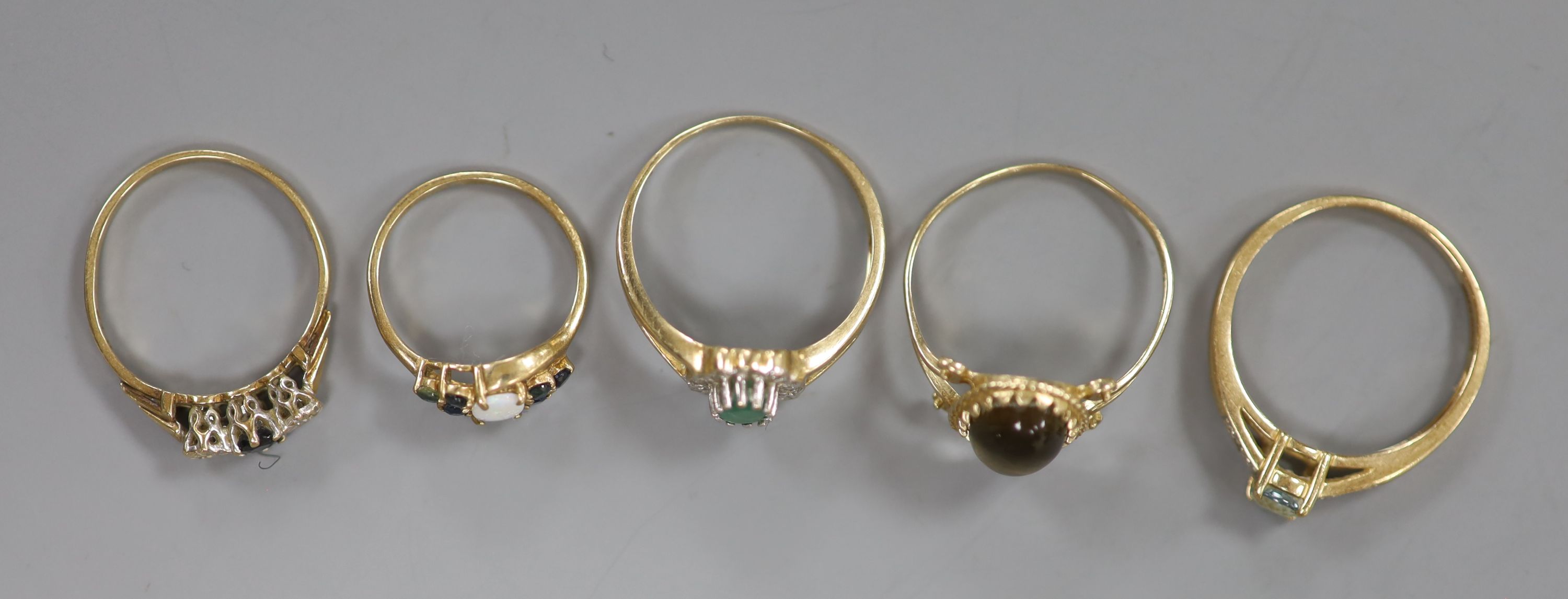 Five assorted modern 9ct gold and gem set rings